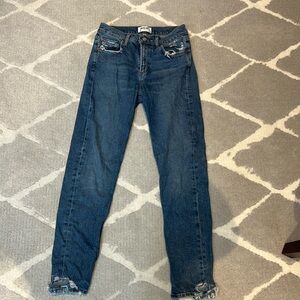 Agolde mid rise jeans with distressed pockets and ankles